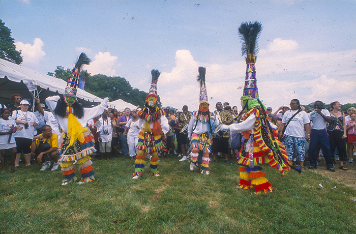 A <i> gombey </i> “clash” dance at the 2001 Smithsonian Folklife Festival. Ralph Rinzler Folklife Archives and Collections, Smithsonian Institution