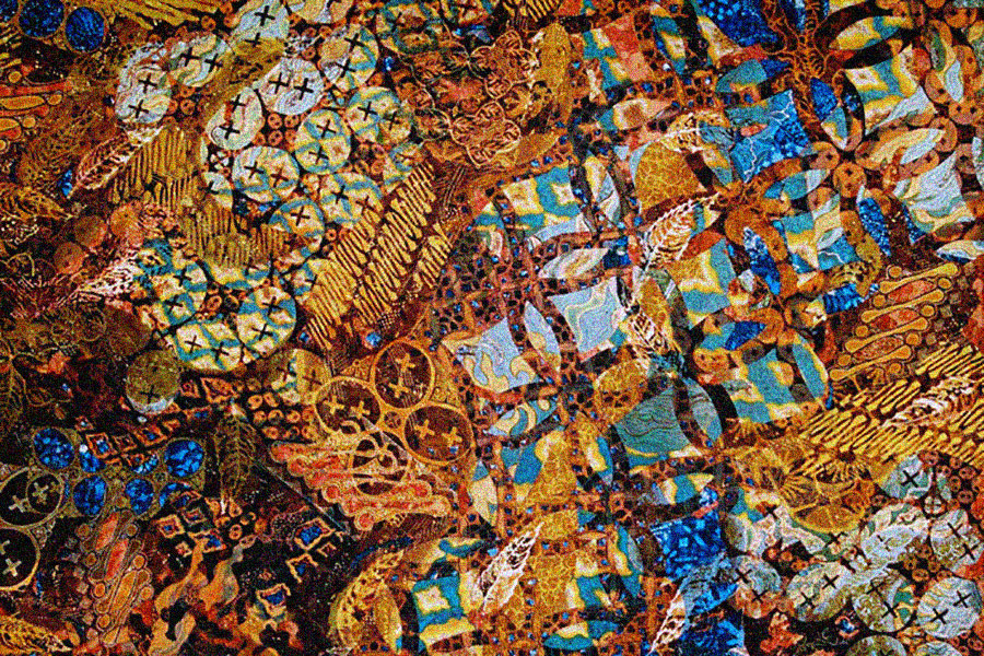 Dyed, printed textile in shades of brown, blue, yellow, and white, with various geometric patterns layered on top of each other.