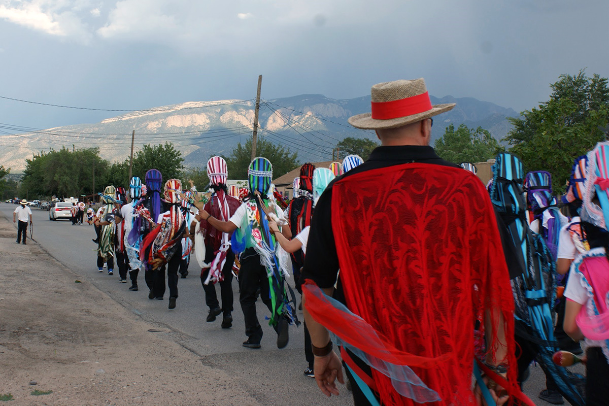 The Matachines dance in procession through Bernalillo in the 2018 San Lorenzo Fiesta. Photo by Gerardo Carrillo