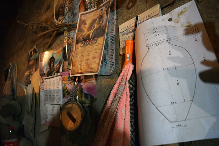 A technical drawing of a karas hangs on the wall of Serioj Asatryan’s pottery studio in Yuva village.